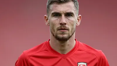 Conor McMenamin has made a spectacular return to Glentoran just two months after his high-profile move to Coleraine, in...